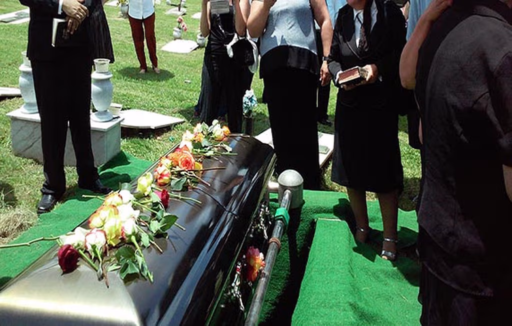 Family gathering at a graveside service at Mount Harmony Memorial Gardens